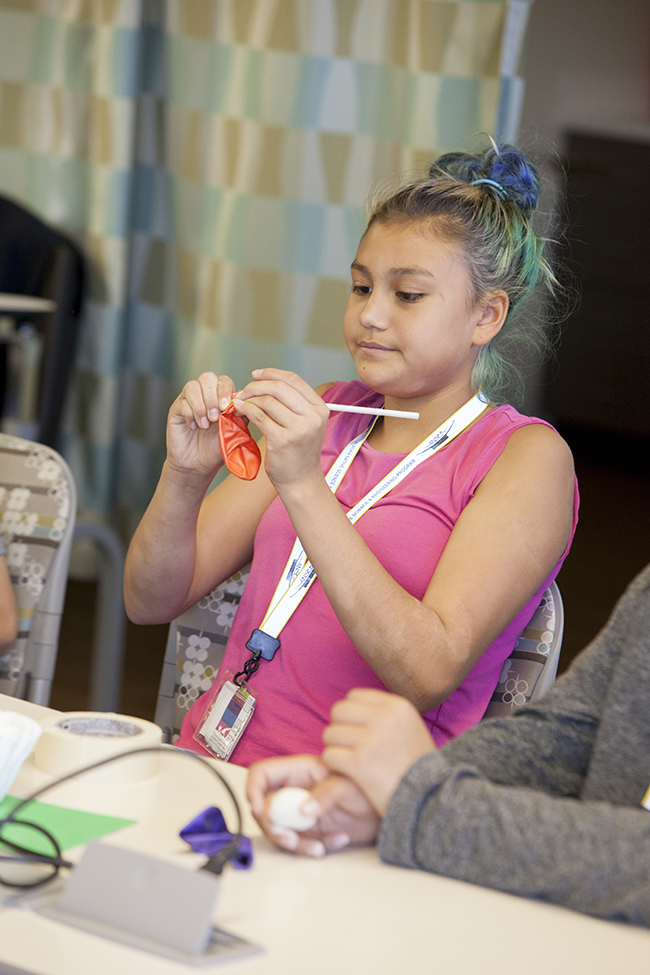 Aphanasia Kvasnikoff creates model lungs during ANSEP’s STEM Career Explorations in July 2015